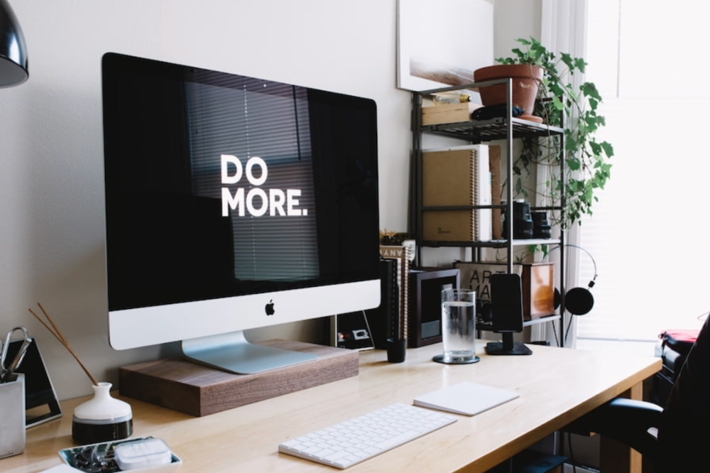 Motivational 'Do more' quote on computer